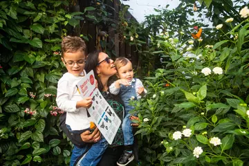 Family inside a butterfly house