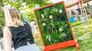 A visitor playing Animal Tail Hoopla at London Zoo