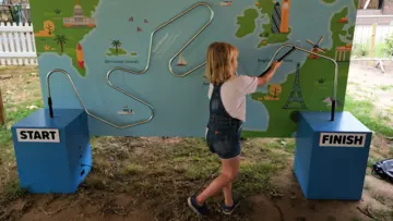 A child playing Don't Buzz the Buzzer at London Zoo