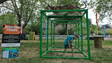 Children playing Sleeping Tigers at London Zoo