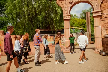 Lodge hosts taking guests on a tour
