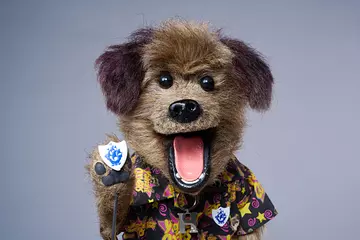 Blue peter presenter with badge