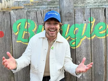 Cam Whitnall wearing his Deliver Zoo hat at London Zoo during Blue Peter filming