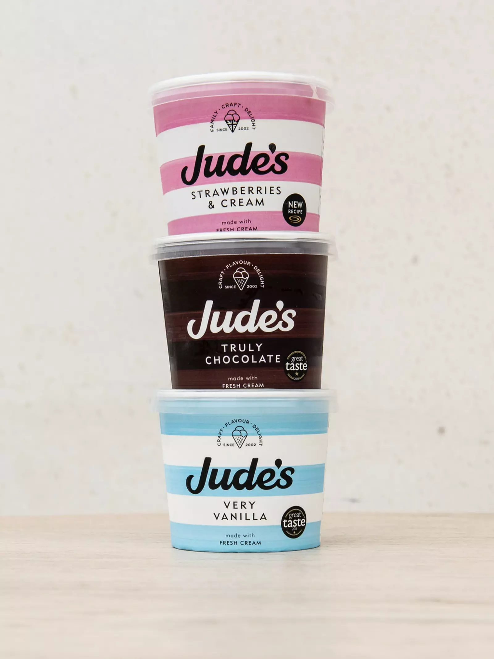 A tower of three Jude's brand ice cream tubs 