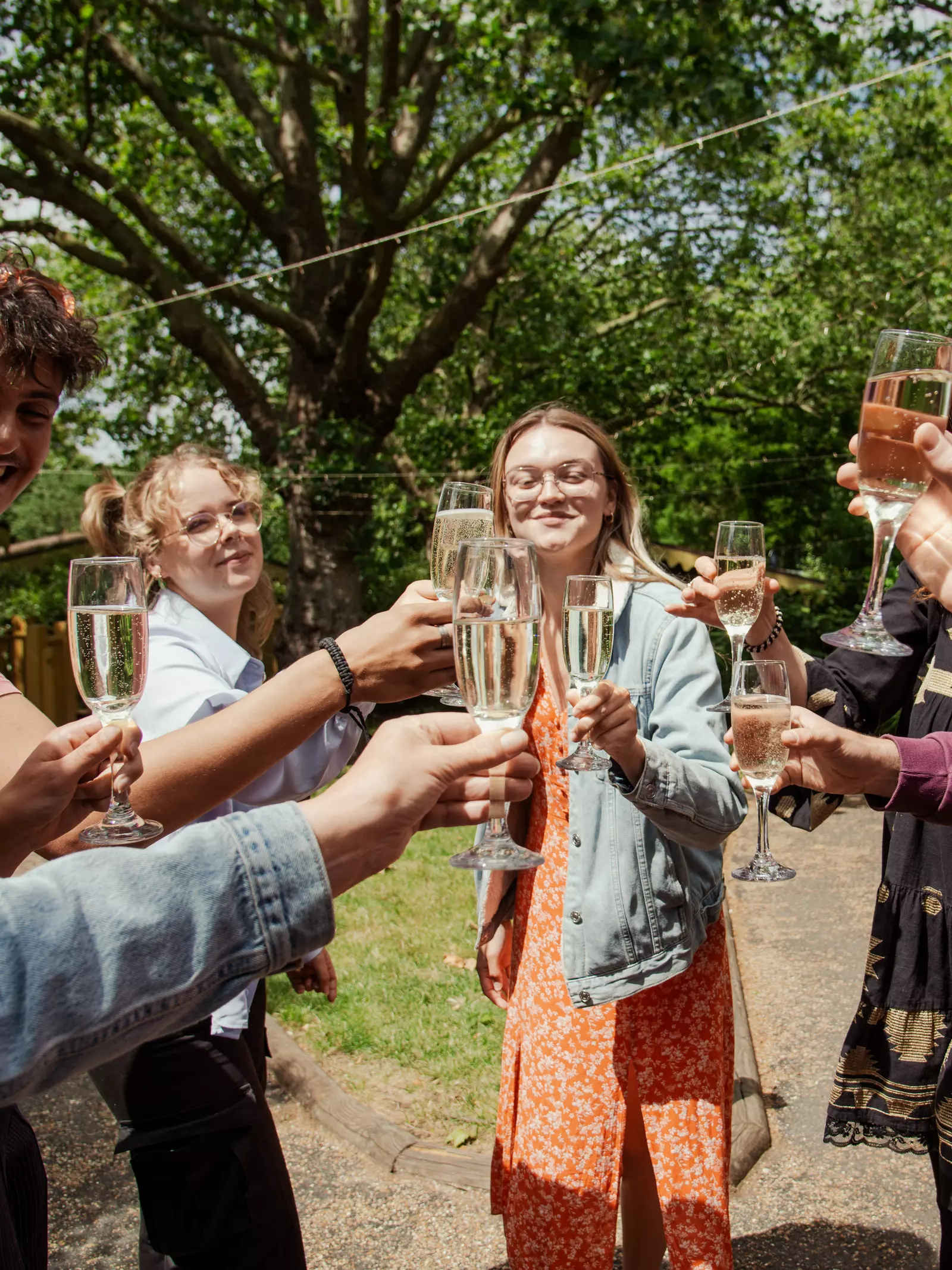 Lodge guests cheers-ing prosecco 