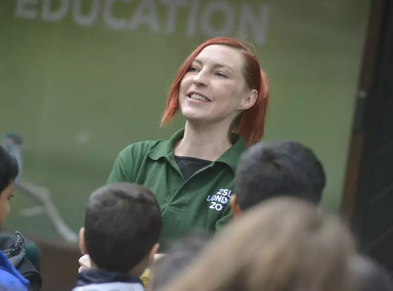 Learning Officer addresses students in front of the education building at London Zoo