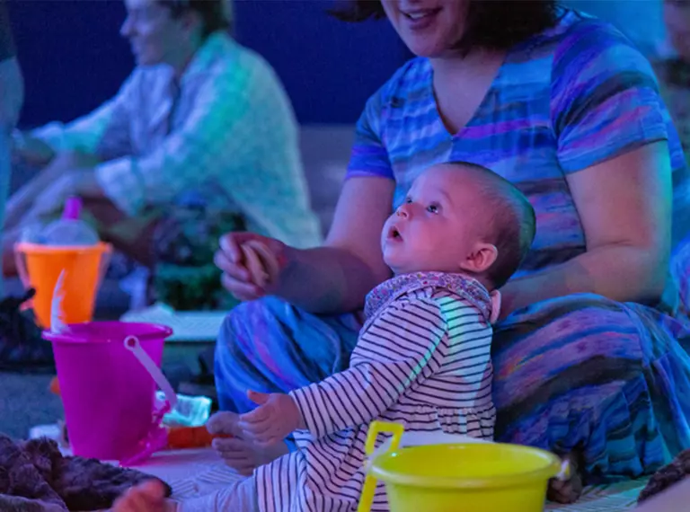 Baby and a woman taking part in the Baby Sensory Stories experience at London Zoo