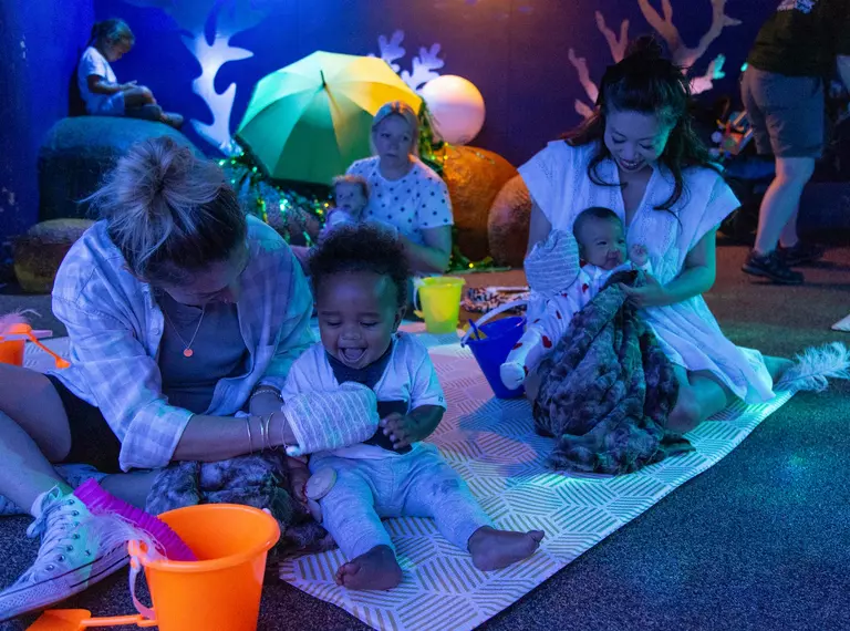 Babies and mothers participating in the Baby Sensory Stories Experience at London Zoo 