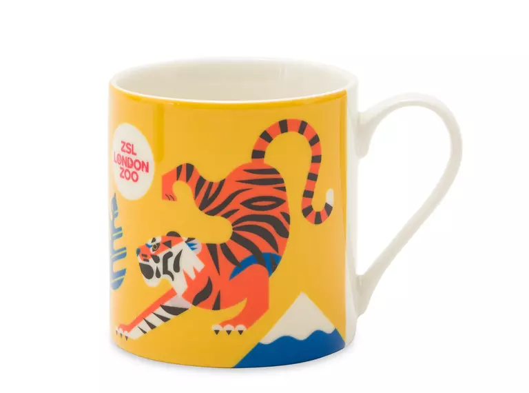 A yellow souvenir tiger mug from London Zoo