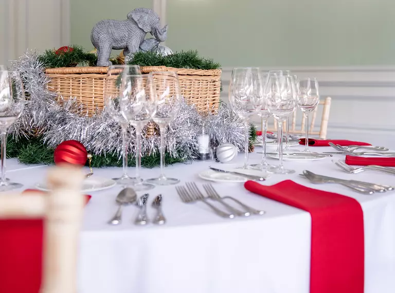 Christmas party table setting including a hamper