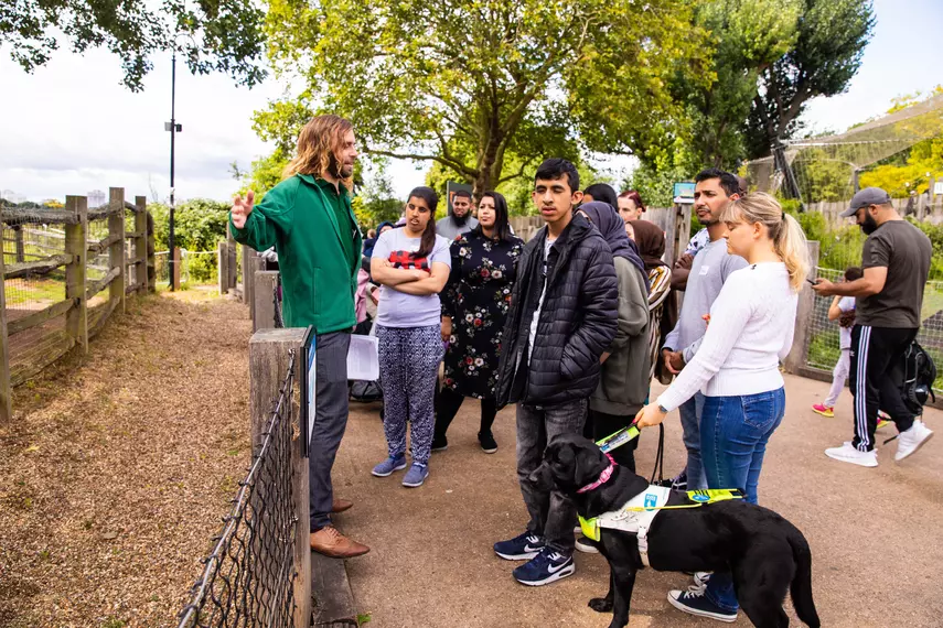 A group of blind or partially sighted people attending a tour