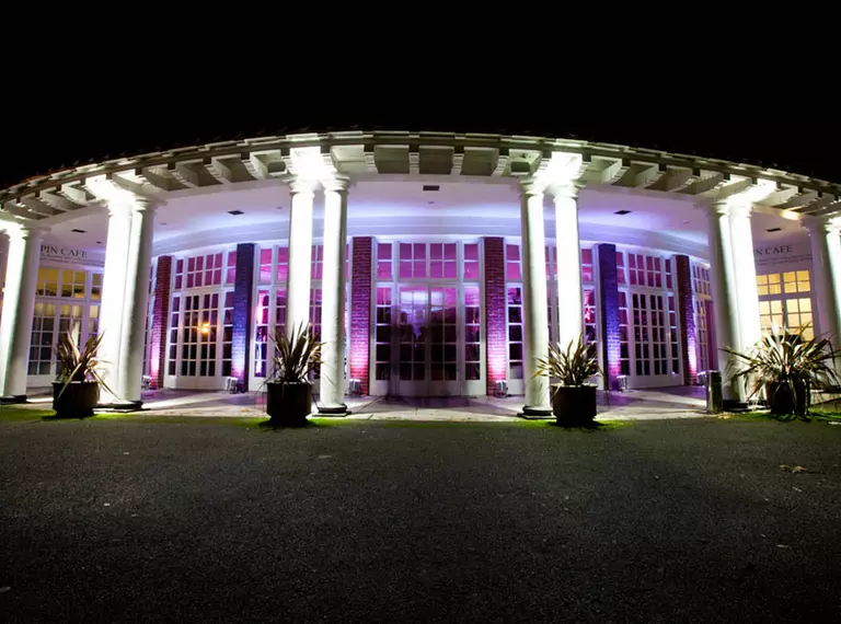 The exterior of the Mappin Pavilion lit up at night 