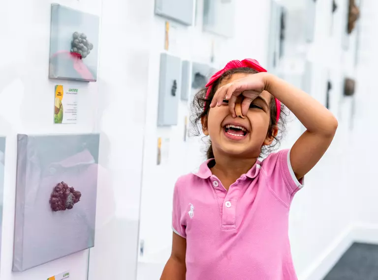 girl pinching nose