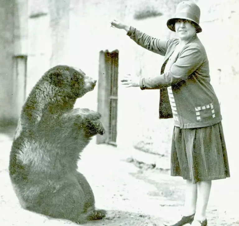 The black bear Winnie which provided inspiration for Winnie the Pooh, sitting with a woman,