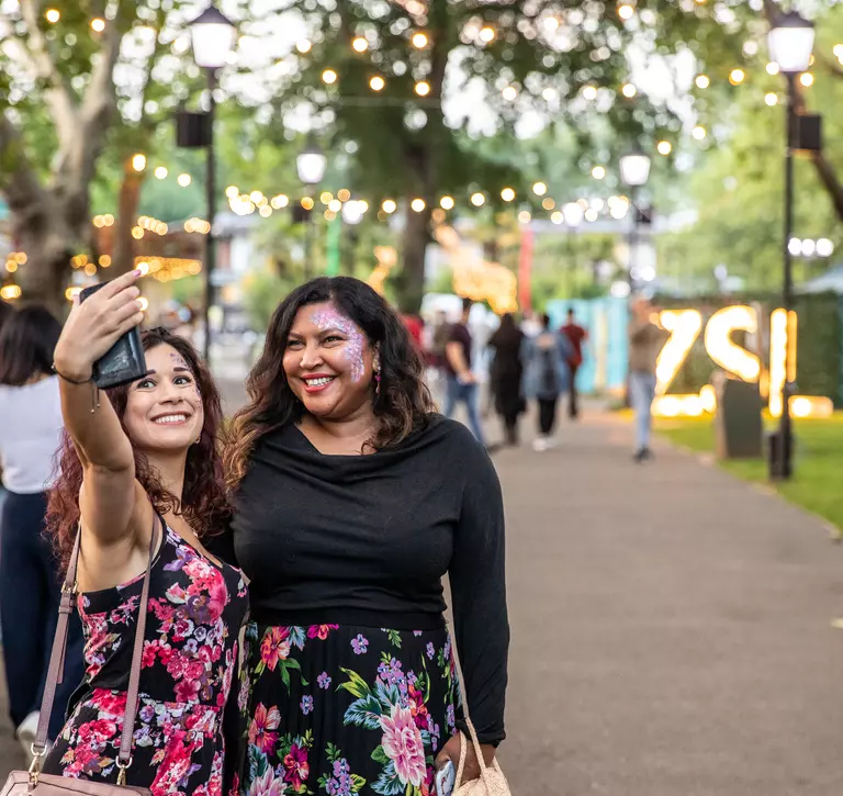 Two people pose for a selfie at London Zoo